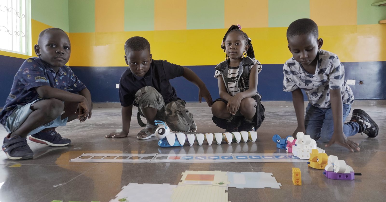 Codellenium students exploring educational robots together in class